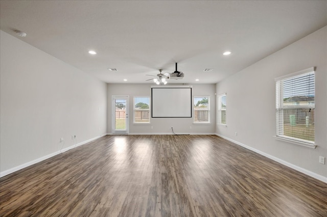 spare room with ceiling fan and dark hardwood / wood-style floors