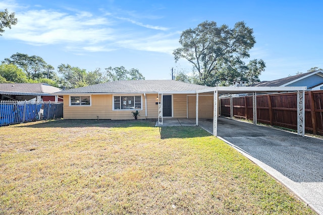 ranch-style home featuring a front yard