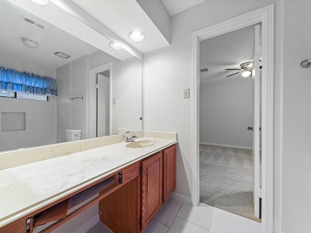 bathroom with vanity, ceiling fan, tile patterned flooring, and toilet