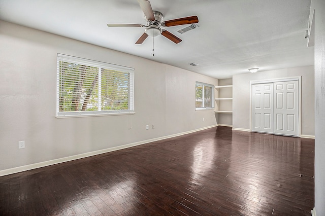 unfurnished room featuring ceiling fan and dark hardwood / wood-style floors