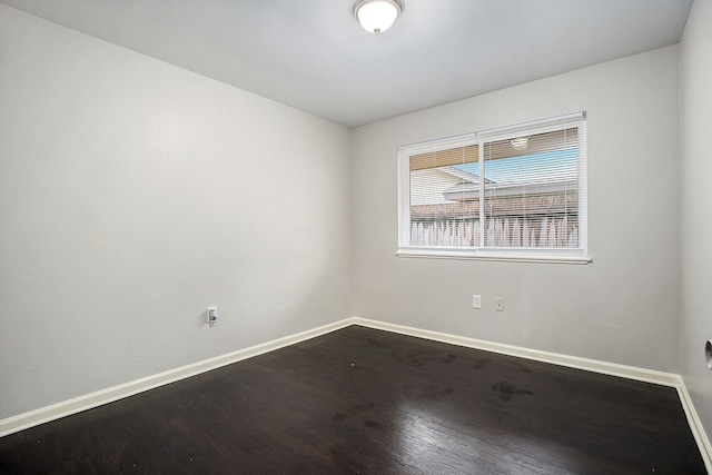 spare room featuring hardwood / wood-style floors