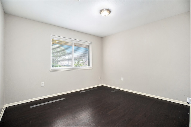 empty room featuring dark hardwood / wood-style floors