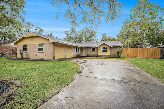 ranch-style home featuring a front lawn and a garage