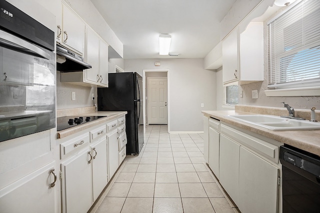 kitchen with white cabinetry, black appliances, and sink