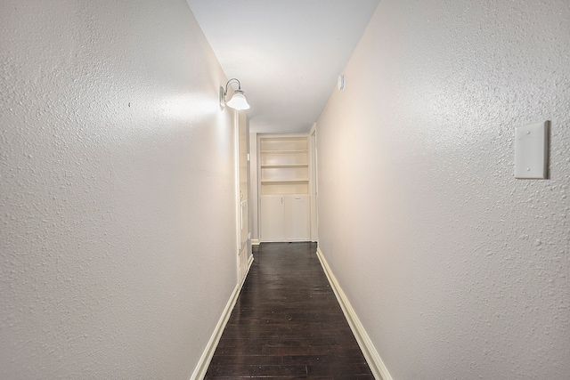 hall featuring dark wood-type flooring