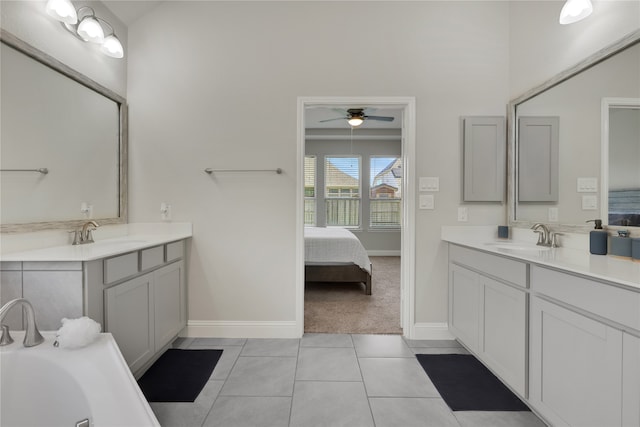 bathroom featuring vanity, ceiling fan, and tile patterned floors