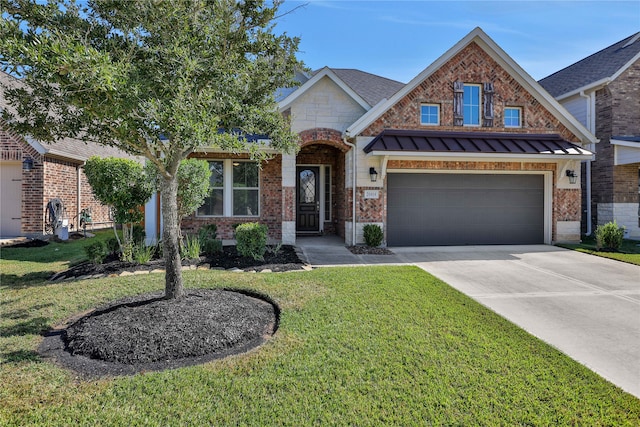 view of front of home featuring a front yard and a garage