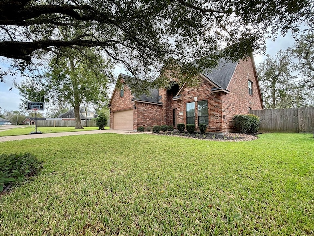 view of front facade with a garage and a front yard