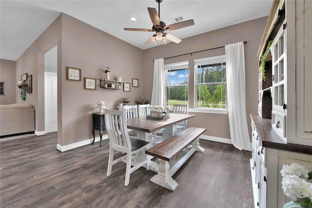 dining space featuring dark wood-type flooring and ceiling fan