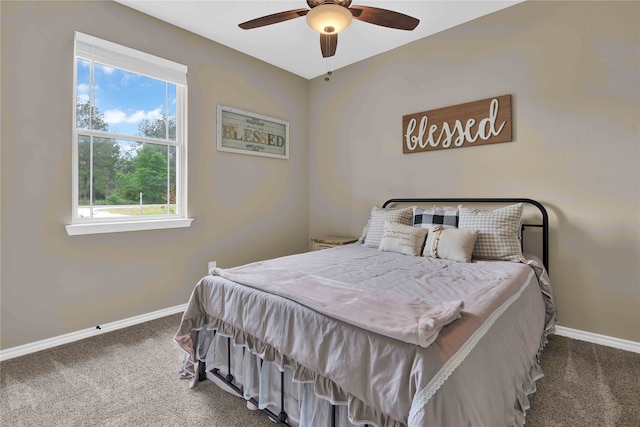 bedroom featuring multiple windows, carpet flooring, and ceiling fan