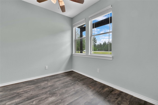 spare room with ceiling fan and dark hardwood / wood-style floors