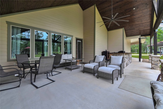 view of patio / terrace featuring an outdoor kitchen, ceiling fan, and an outdoor hangout area