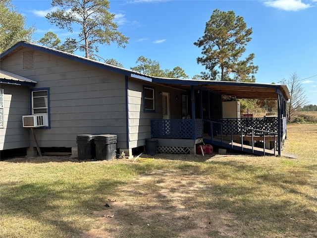 back of property with cooling unit and a yard