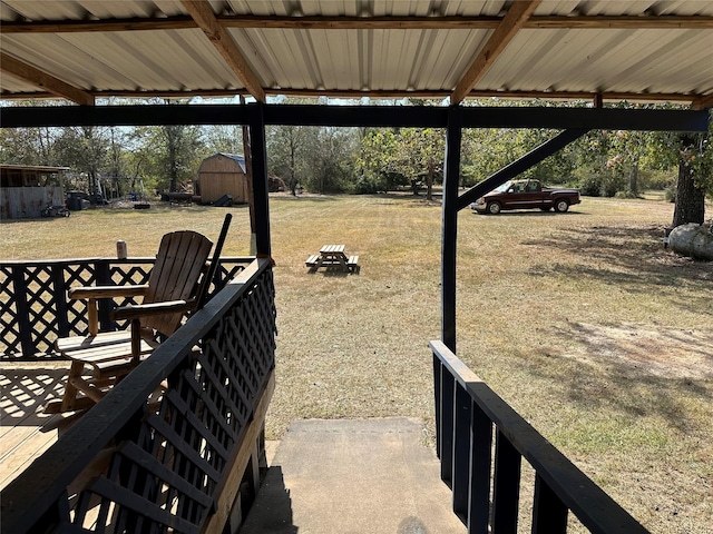 view of yard with a fire pit and a shed