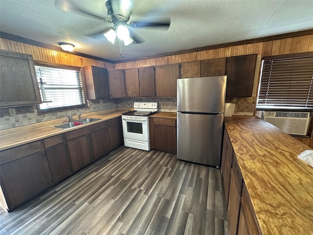 kitchen featuring white electric range, sink, cooling unit, stainless steel fridge, and dark hardwood / wood-style flooring