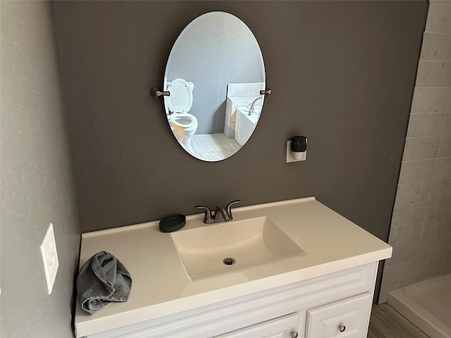 bathroom with vanity and a shower