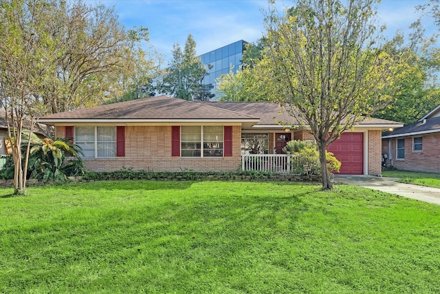 ranch-style home featuring a front lawn and a garage