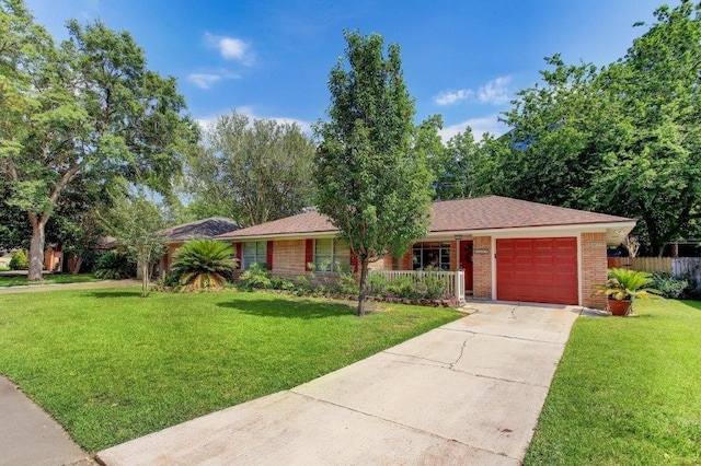 ranch-style house with a garage and a front lawn