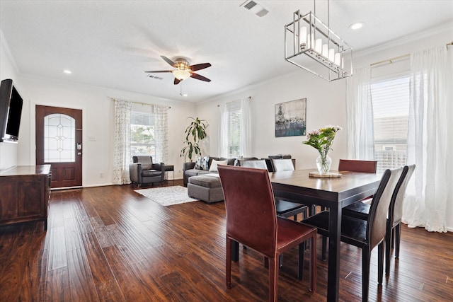 dining area with ceiling fan, dark hardwood / wood-style flooring, and crown molding