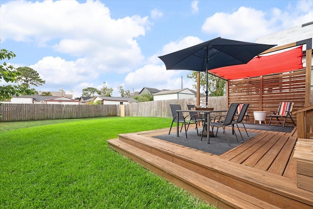 wooden deck with a yard