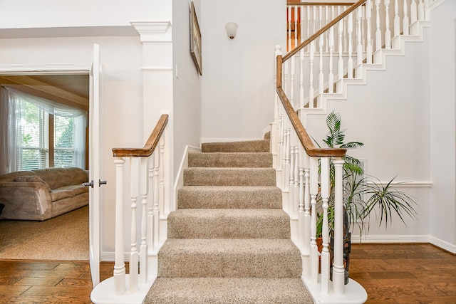 staircase featuring hardwood / wood-style flooring