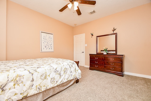 bedroom with ceiling fan and light colored carpet