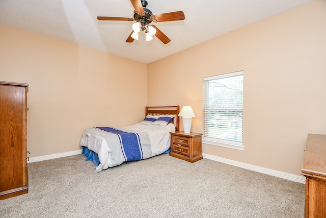 bedroom featuring light colored carpet and ceiling fan