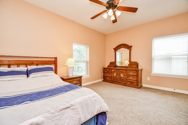 bedroom with light carpet and ceiling fan