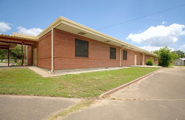 view of property exterior featuring a lawn