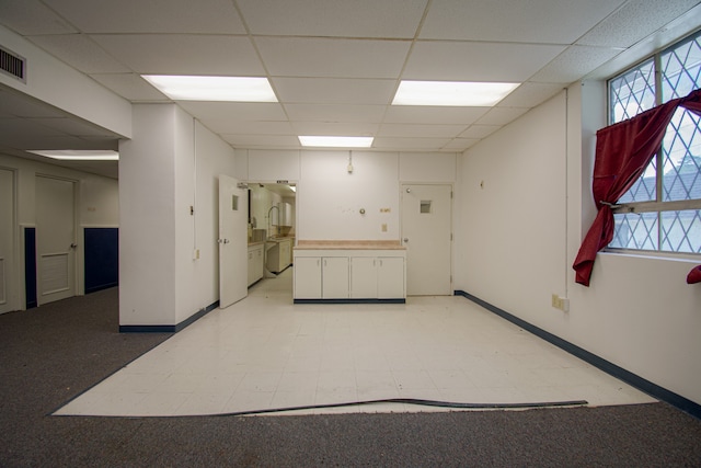 unfurnished room with a paneled ceiling