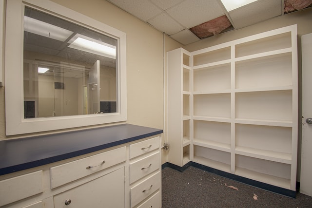 walk in closet with a drop ceiling