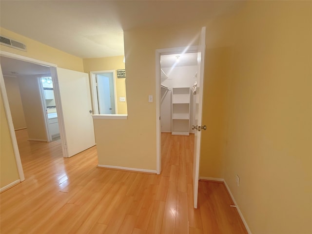 corridor featuring light hardwood / wood-style flooring