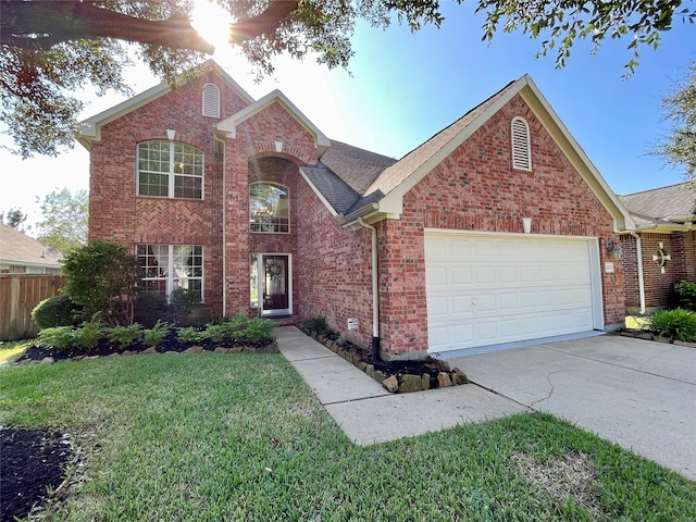 view of front property with a garage and a front lawn