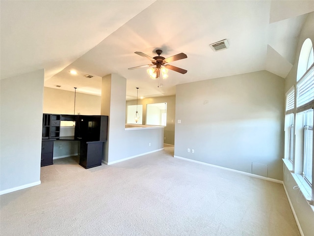 unfurnished living room with ceiling fan and light carpet