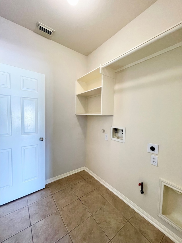 washroom featuring hookup for an electric dryer, hookup for a washing machine, tile patterned flooring, and hookup for a gas dryer