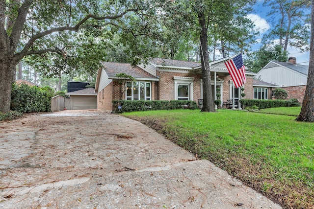 view of front of home featuring a garage and a front lawn