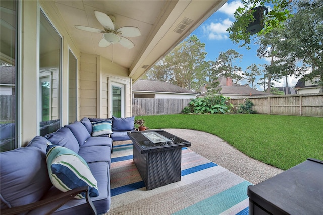 view of patio / terrace featuring ceiling fan, an outdoor living space with a fire pit, a fenced backyard, and visible vents