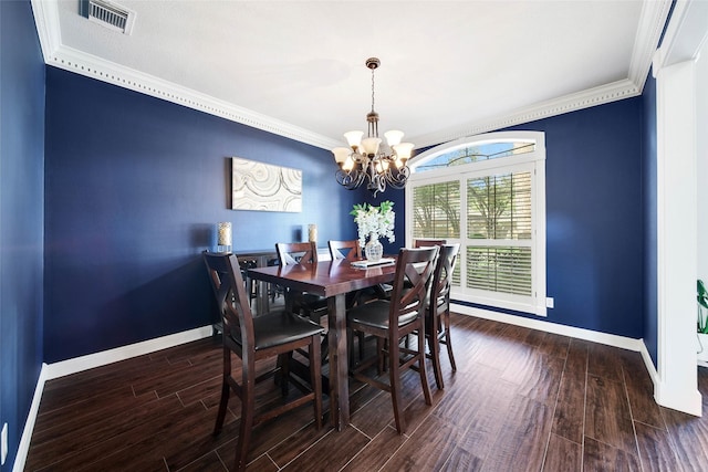 dining room with dark wood-style floors, crown molding, visible vents, and baseboards