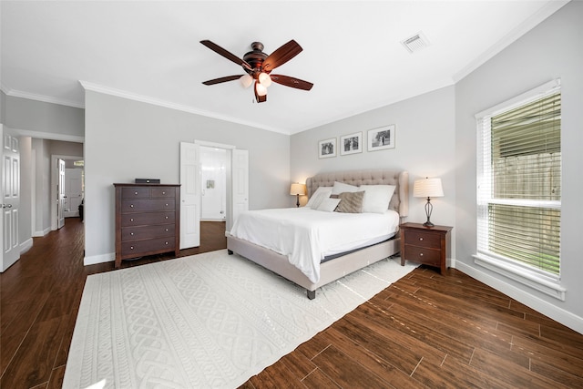 bedroom with multiple windows, dark hardwood / wood-style floors, and ceiling fan