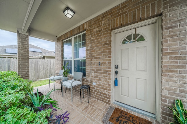 entrance to property featuring covered porch