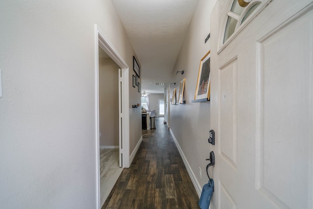 corridor with dark wood-type flooring