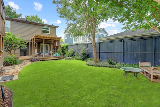 view of yard with a wooden deck and a pergola