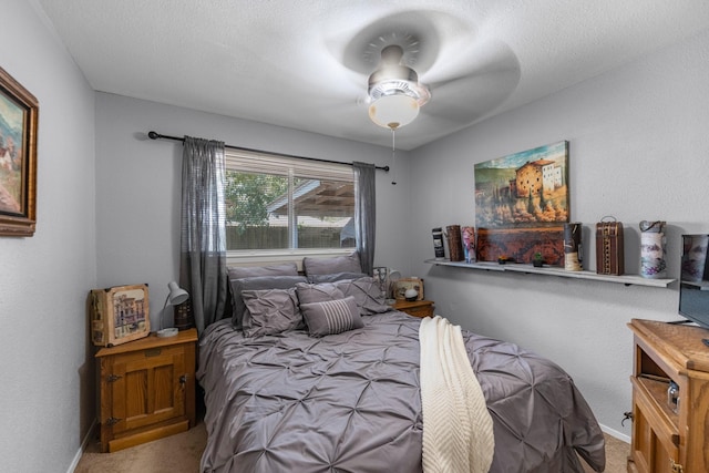 bedroom with carpet flooring, baseboards, and ceiling fan