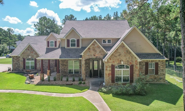 craftsman-style home featuring a front lawn