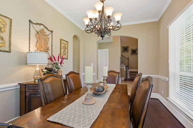 dining area featuring an inviting chandelier and ornamental molding