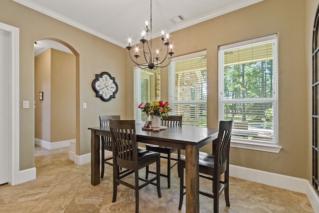 dining area with a wealth of natural light, a notable chandelier, and ornamental molding