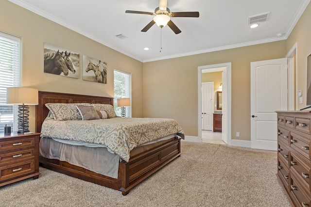 carpeted bedroom with ornamental molding, ceiling fan, and ensuite bathroom