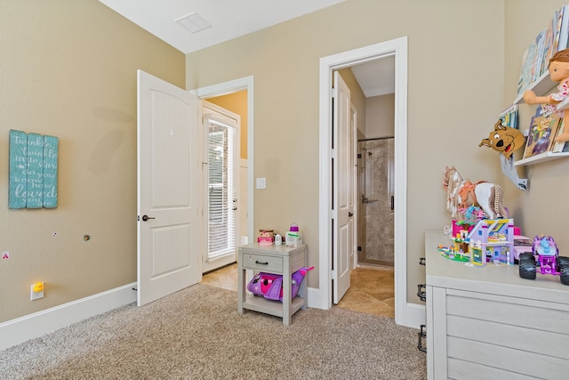 bedroom with light colored carpet