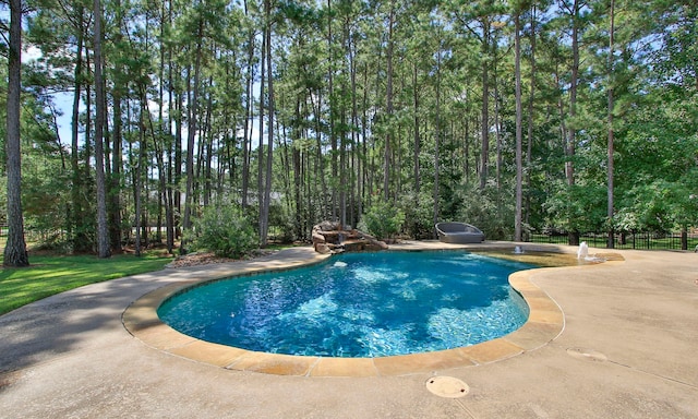 view of swimming pool featuring a patio area