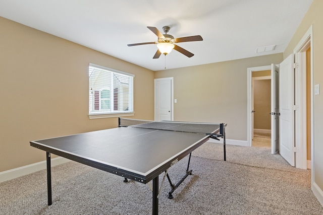 rec room with light colored carpet and ceiling fan